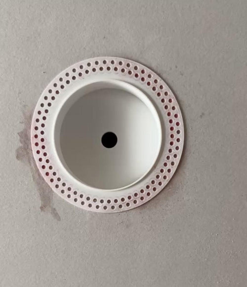 Round Google Nest flush drywall platform with a perforated mud-in flange