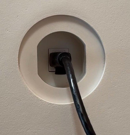 Cat6 Ethernet cable connected inside a trimless round wall niche