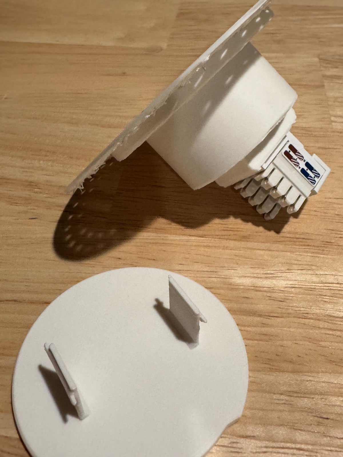 Rear and side view of the round Cat6 wall niche and removable lid