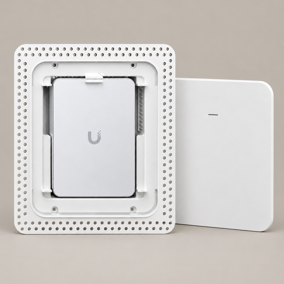 Front-facing product render of the white Maker Is UniFi U7 Pro Wall flush drywall mount, showing the access point and removable cover. Access point not included.