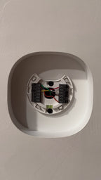 Installation fit demonstration: ecobee Smart Thermostat Premium fitted into the finished white contoured drywall niche