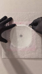 Drywall finishing demonstration showing mesh and joint compound applied around the white Ecobee Premium contoured niche