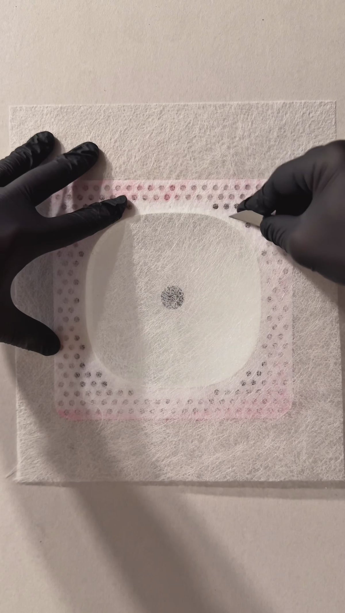 Drywall finishing demonstration showing mesh and joint compound applied around the white Ecobee Premium contoured niche