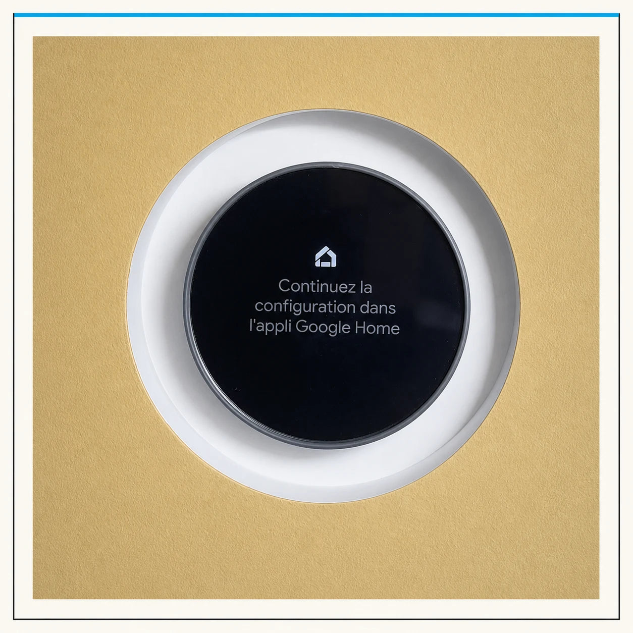 Google Nest thermostat installed inside a white circular wall mount