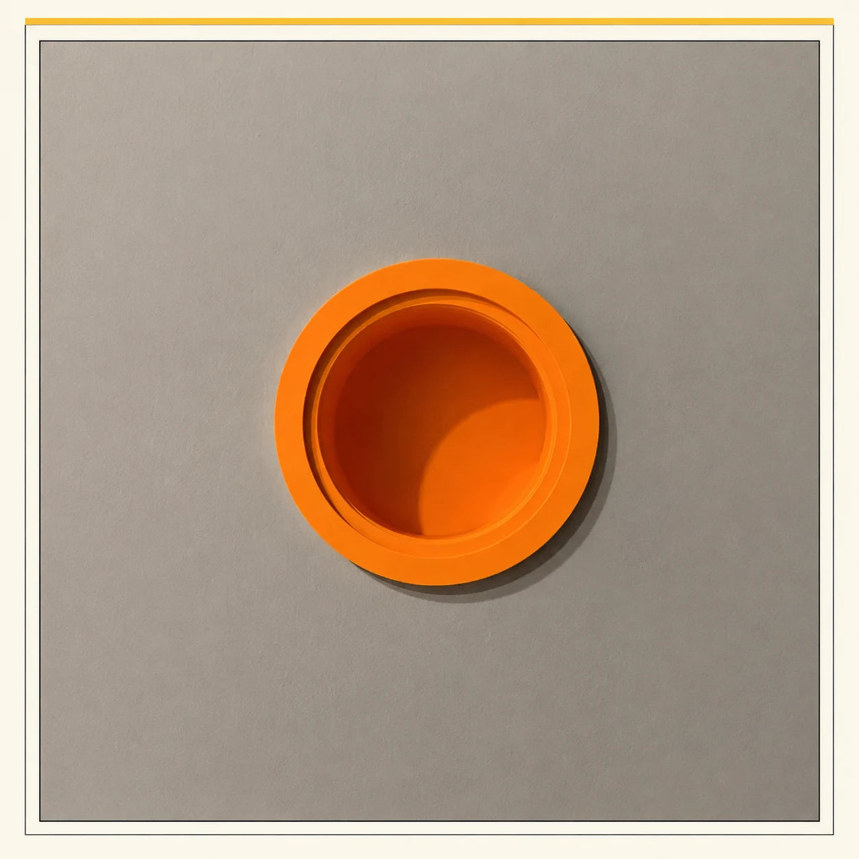Orange circular framed niche installed in a gray wall
