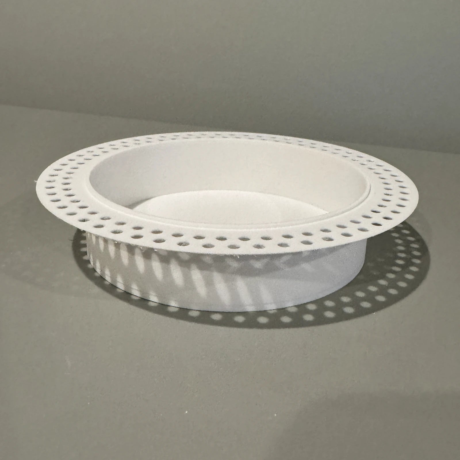 White round recessed drywall niche with an integrated perforated mud-in flange