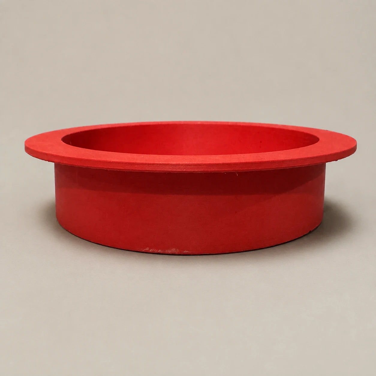Red round recessed niche with a smooth visible frame shown from the side