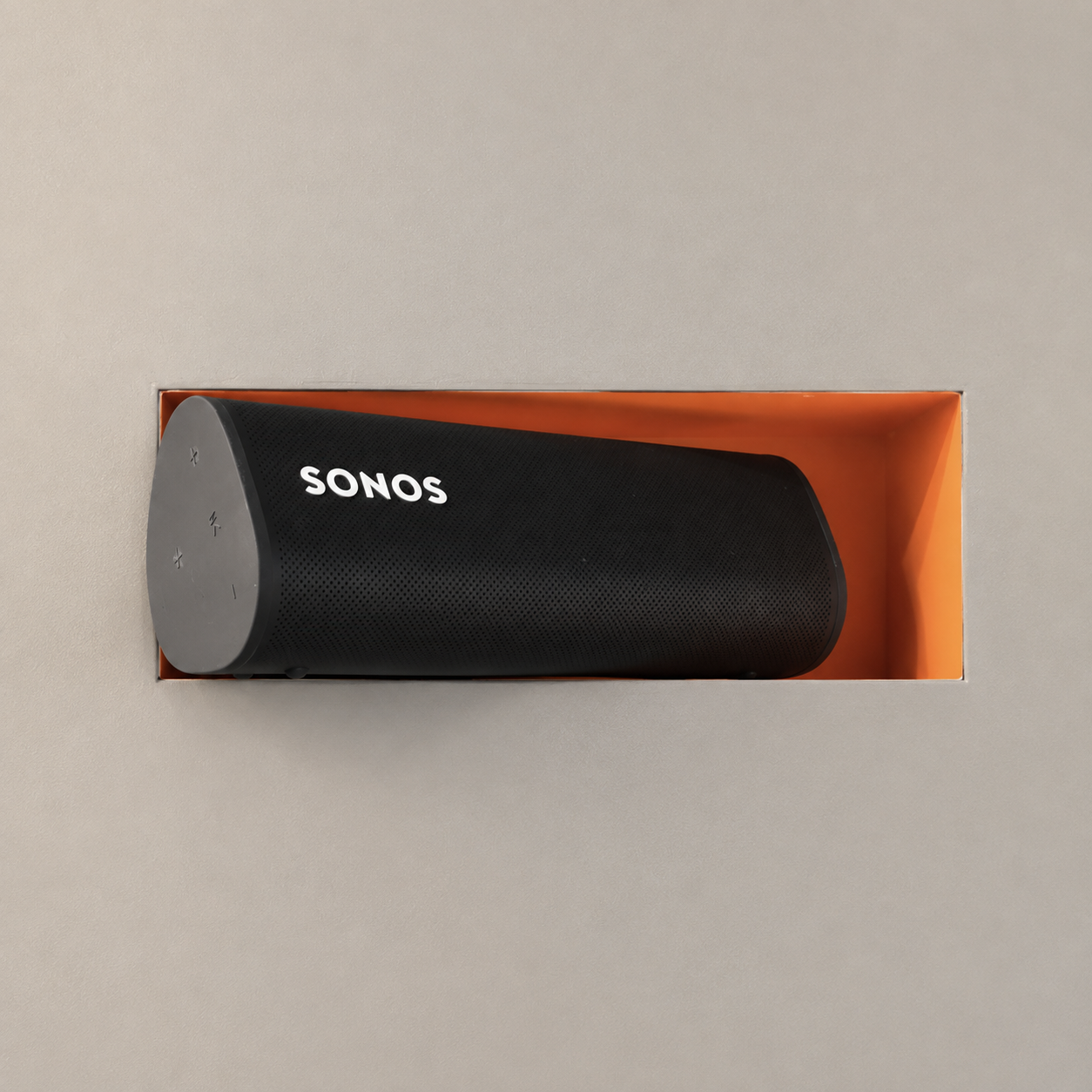 Sonos Roam installed in an orange trimless recessed drywall mount on a neutral wall