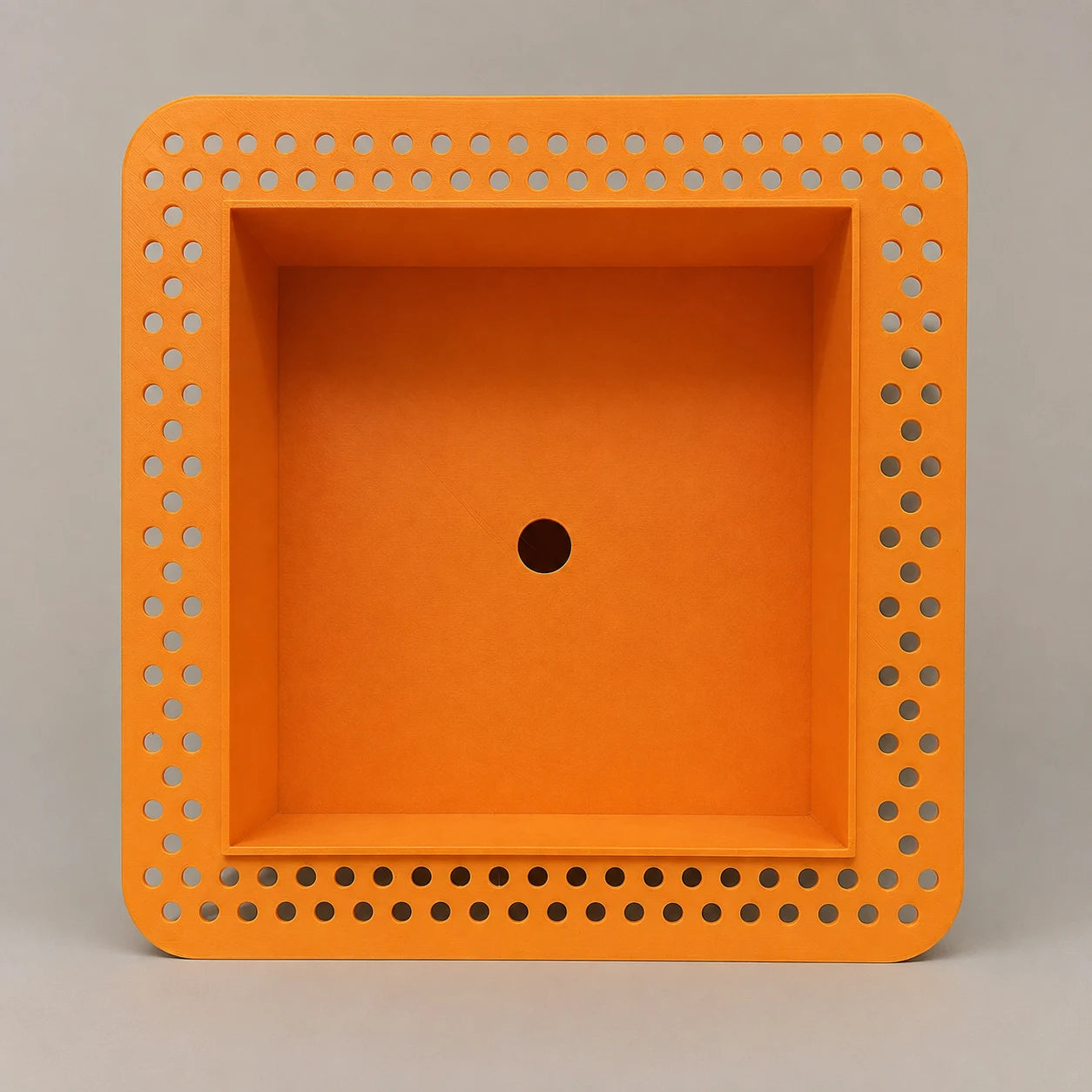 Orange square recessed niche with an integrated perforated mud-in flange